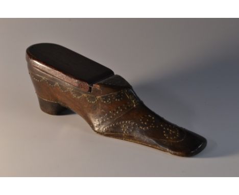 A 19th century novelty snuff box, as a shoe, decorated with brass pinwork, 13cm long