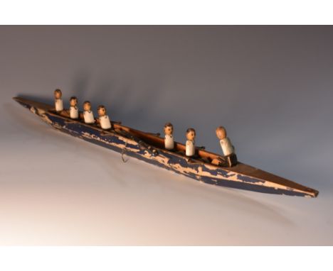 Rowing - an early 20th century folk art softwood model, of a rowing boat, 32cm long