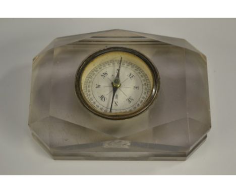 A late Victorian clear glass novelty combination compass and desk weight, facetted borders, 10.5cm wide, c.1900 
