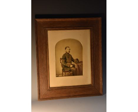 Photography - Militaria - a mid-19th century sepia photographic portrait, of a British Army officer, three-quarter length, ha
