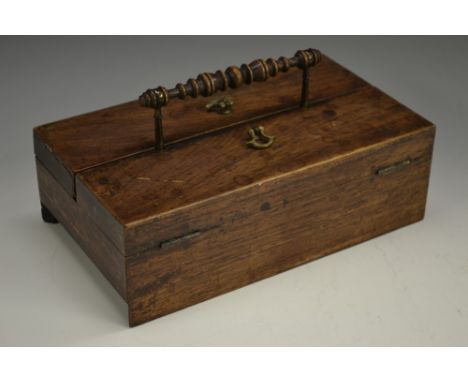 A George IV rosewood portable writing box, turned handle, hinged twin-covers enclosing an inkwell and compartments, 24cm wide