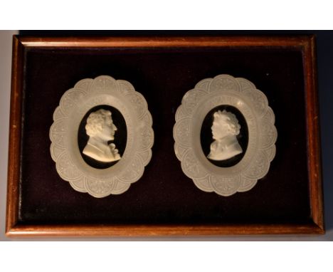 A pair of 19th century alabaster and marble portrait plaques, of gentlemen, bust length, facing to dexter and sinister, each 