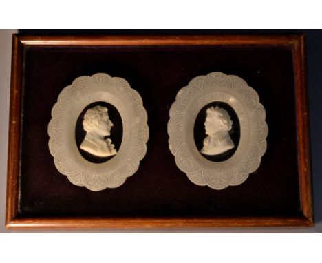 A pair of 19th century alabaster and marble portrait plaques, of gentlemen, bust length, facing to dexter and sinister, each 