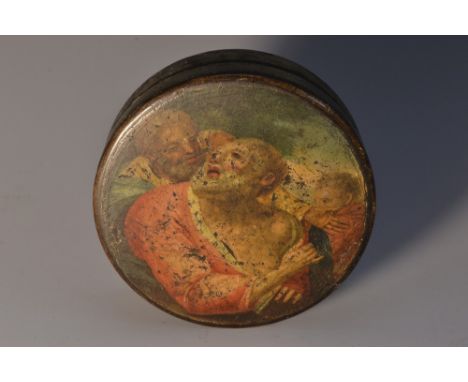 An early 19th century papier-mâché circular snuff box, the push-cover painted after an Old Master, with three saints, 7.7cm d
