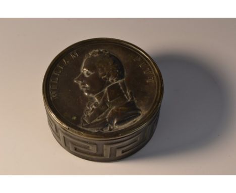 A 19th century brass circular snuff box, push-cover with embossed with a named profile portrait of William Pitt the Younger, 