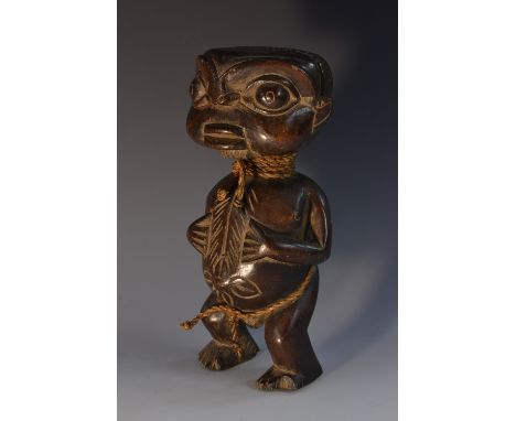 Tribal Art - an African hardwood figure, broad head with stylised features, 24.5cm high
