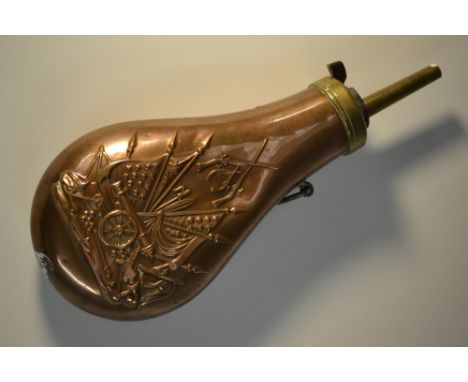 A 19th century copper tear-shaped powder flask, embossed with American flags, arms, militaria and trophies of war, loop suspe