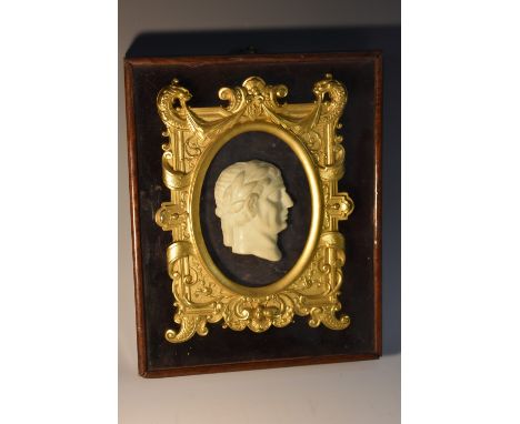 A 19th century Grand Tour marble portrait plaque, of the head of a Roman Emperor, fully-turned to dexter, wearing a laureate 
