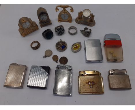 Seven vintage lighters to include Consul, four miniature clocks, gents, fashion rings and other itemsLocation: porter 