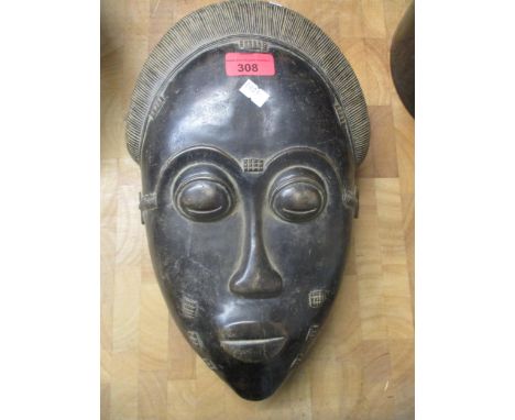 An early 20th century Mblo portrait mask, Baule culture, Ivory CoastLocation: RWF 