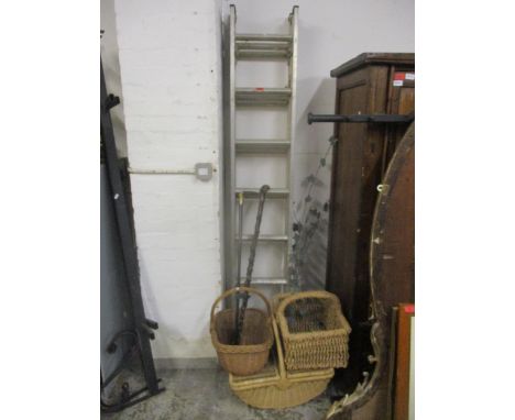 A mixed lot to include a metal folding ladder, ornamental metal ivy, wicker baskets, a walking can, and an ebony walking cane