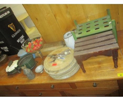 A collection of kitchenalia to include five carved bread boards, three rolling pins, a green painted wooden egg stand, and a 