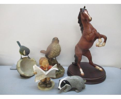 Mixed ornaments to include a Royal Doulton Spirit of the Wild horse, Hummel Latest News, Szeiler Badger and two Christopher H