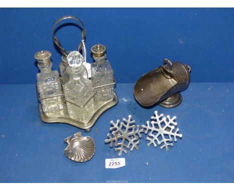 A 19th century four bottle table cruet on a stand, shell trinket dish, a coal scuttle shape sugar basin, plus two white metal