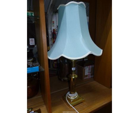 A large brass lamp and shade  21" high.