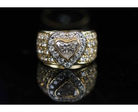 A FINE HEART SHAPED DIAMOND RING, set to the centre with a brilliant cut heart shaped diamond weighing 0.95 carats within a s