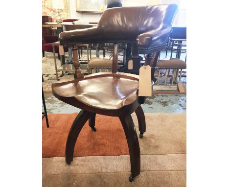 DESK CHAIR, 19th century mahogany, with studded leather bow back and revolving shaped solid seat (serial number under), 57cm 