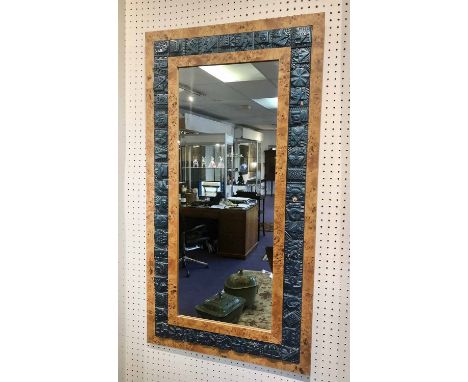 RON HITCHENS (b.1926) WALL MIRROR, circa 1970's glazed ceramic tiles mounted on a birds eye maple frame, signed, 98cm x 52cm.