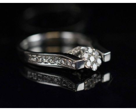 DIAMOND 'DANCING' RING, the 18 carat white gold ring finely set with brilliant cut diamonds, finger size N.