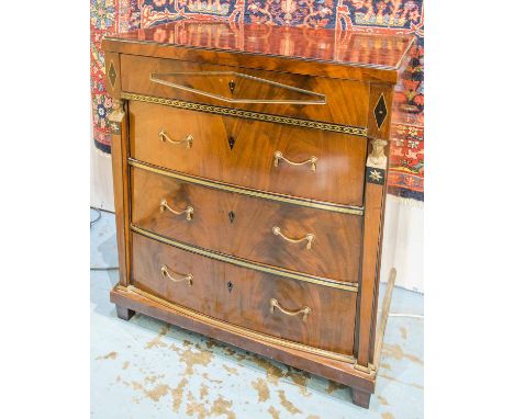 COMMODE, early 19th century Russian mahogany, ebony and brass mounted with panel frieze drawer above three bowed drawers, 104