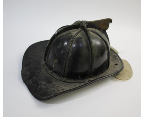 VINTAGE AMERICANS FIREMAN'S HELMET a Cairns &amp; Brother fireman's helmet, with makers label inside Cairns &amp; Brother, Cl