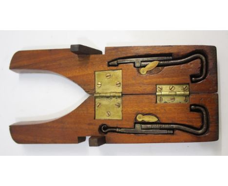 VINTAGE FOLDING CASED BOOT JACKS a mahogany folding case, with two metal folding boot jacks inside. Case 31cms long