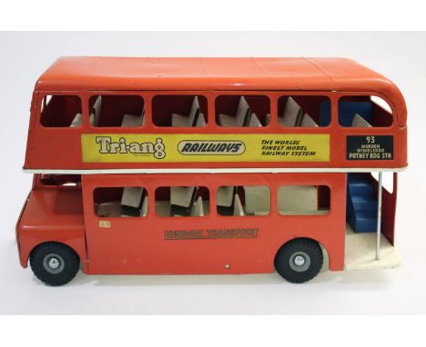 LARGE TRIANG PULL ALONG VINTAGE ROUTEMASTER BUS a large metal bus with advertising decals to both sides, 56cms long, 31cms hi