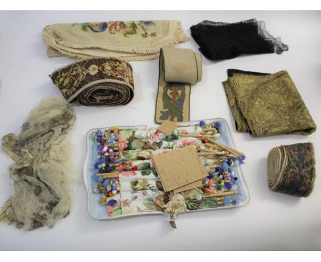 LACE BOBBINS &amp; TEXTILES a mixed lot including various wooden lace bobbins, a panel of gold coloured embroidery onto a bla
