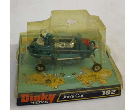 DINKY TOYS - JOE'S CAR 102 Joe's Car, in metallic green with red engine thruster and driver. In a bubble pack.