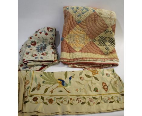 VINTAGE TEXTILES including a linen embroidered susani, an early 20thc patchwork quilt, a silk panel embroidered with a peacoc