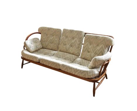 A mid century Ercol Jubilee three seater sofa  76½ x 36½in. (194.3 x 92.7cm.), 32in. (81.2cm.) high.  *Some straps need repla