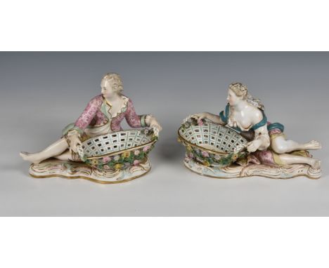 A pair of Meissen porcelain bon-bon baskets circa 1880  modelled as reclining male and female figures each with basket weave 