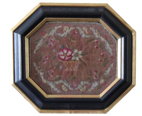 Berlin stitch needlework tapestry  depicting a basket of flowers, set in a black octagonal frame with gilded sight edge, 10¾ 