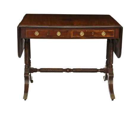 A late Regency mahogany crossbanded sofa table  the crossbanded top and D-end drop flaps over a plain frieze with two crossba
