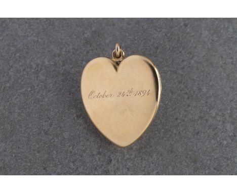 A late 19th century 18ct gold heart pendant locket by Tiffany &amp; Co.  the bale stamped 'Tiffany &amp; Co', the interior st
