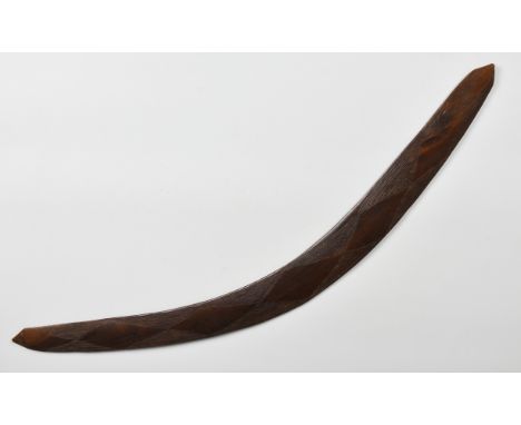 An Aboriginal boomerang  probably first half 20th century, with pointed ends, one side with incised opposed triangle decorati