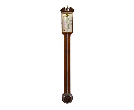 A Georgian-style stick barometer  mid-20th century, the broken architectural top with brass vase finial, over a silvered dial