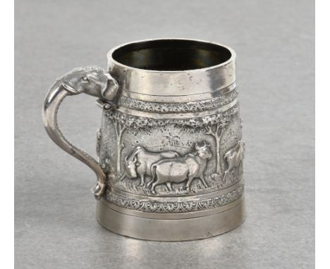 An Indian silver repoussé decorated tankard  T.P.R. &amp; Co, Bombay, cylindrical tapering form, having large band depicting 