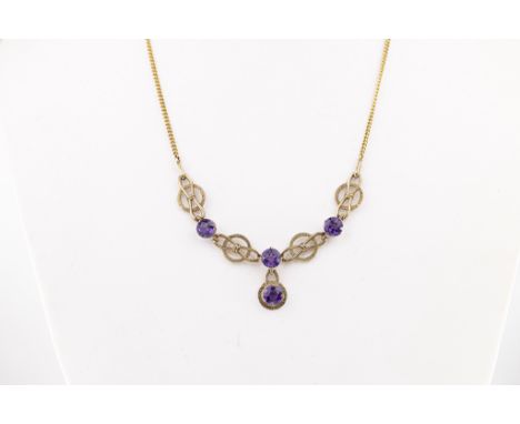 A 9ct gold and amethyst Arts and Crafts style necklace,  set with four round-cut amethyst total 2.45 carats, on an associated