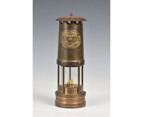 A Welsh miner's safety lamp  brass and copper with glass shade, marked "E Thomas &amp; Williams Ltd, Makers Aberdare, Wales" 