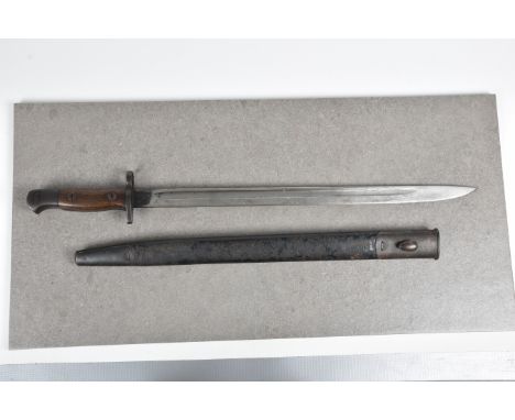 A British 1907 pattern bayonet  having a 17in. straight fullered blade with British broad arrow mark, wooden grip, leather an