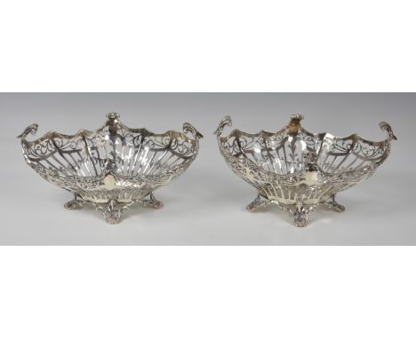 A pair of Edwardian pierced silver bon-bon baskets  Josiah Williams &amp; Co., London 1911, retailer's mark for Birks (Canada