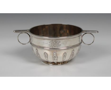 A late Victorian silver porringer  Sibray, Hall &amp; Co Ltd, London, 1900, of circular form with low turned foot, ornate fol