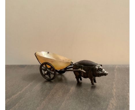 A novelty Edwardian silver pin cushion fashioned as a pig with cart  Robert Pringle &amp; Sons, Birmingham, 1909, modelled in