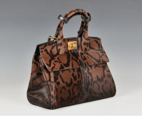 A Salvatore Ferragamo leopard print The Studio top handle tote bag  the pony hide bag with leopard print design, rolled top h