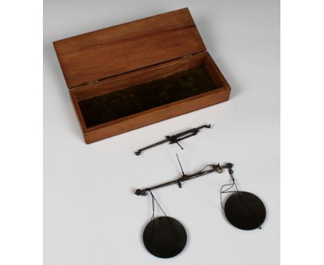 A set of steel hanging scales and brass weights in a mahogany box, with an extra beam the box 9½ x 3½ x 1¼ in. (24.1 x 8.9 x 