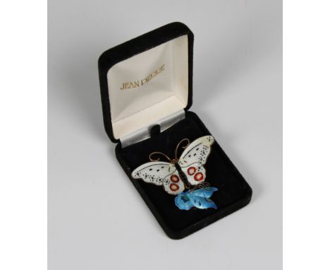 A Norwegian silver and enamel butterfly brooch  the wings with ornate pattern with silver / white colour, highlighted with re