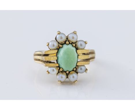 A 1960's 9ct yellow gold pearl and turquoise ring,  the oval cabochon green turquoise surrounded by six pearls, banded should