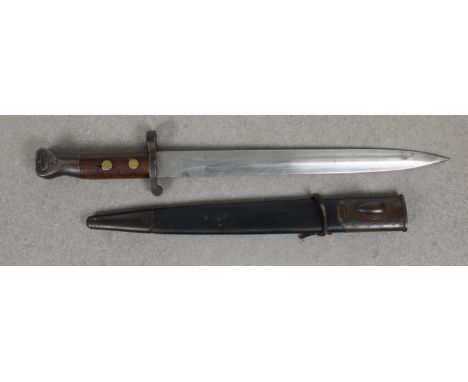 An 1888 British Regimental marked bayonet  wooden two-piece grip secured with brass rivets, 30.5 steel blade, EFD (Royal Arms