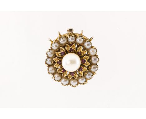 A 9ct yellow gold cultured pearl and ruby circular clasp,  the central pearl approx 7.9mm, surrounded by round-cut rubies in 